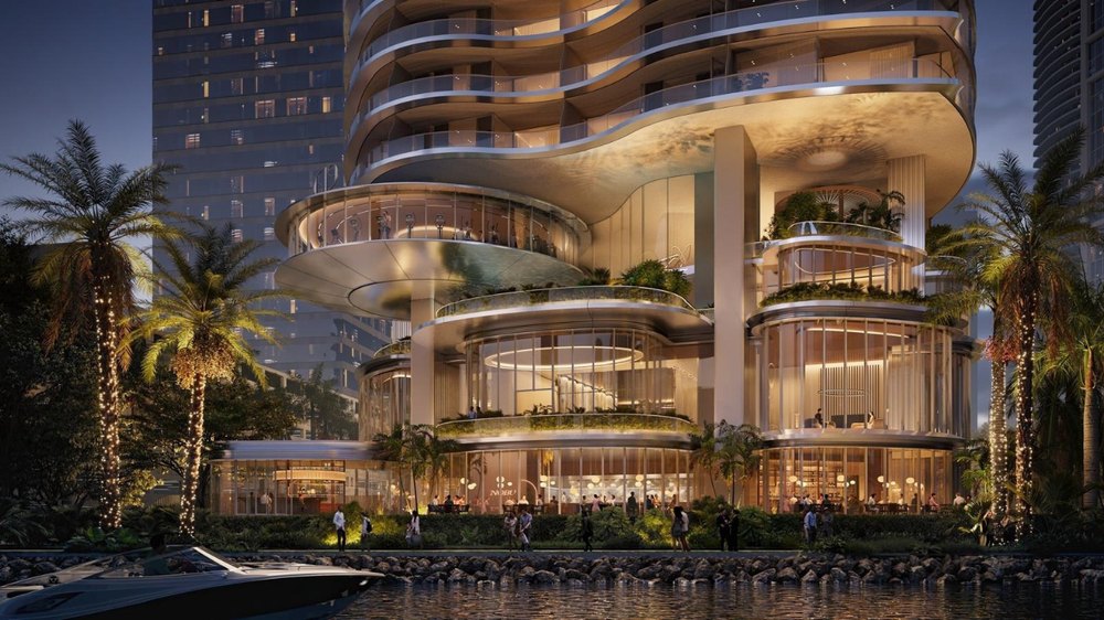 Nobu Residences Miami, rendering of the waterfront podium, restaurant and terraces at dusk